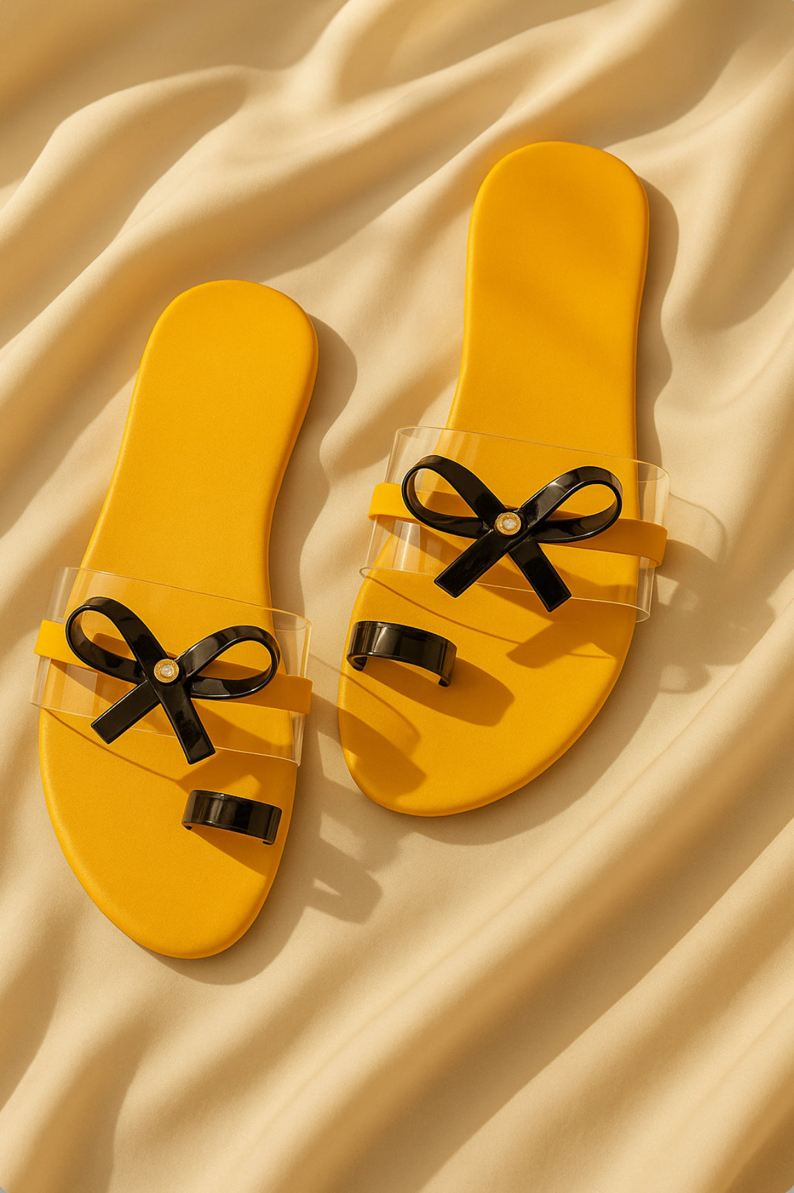 Mustard Yellow Slip-On Sandals with Transparent Straps & Black Bow – Trendy Flats for Women